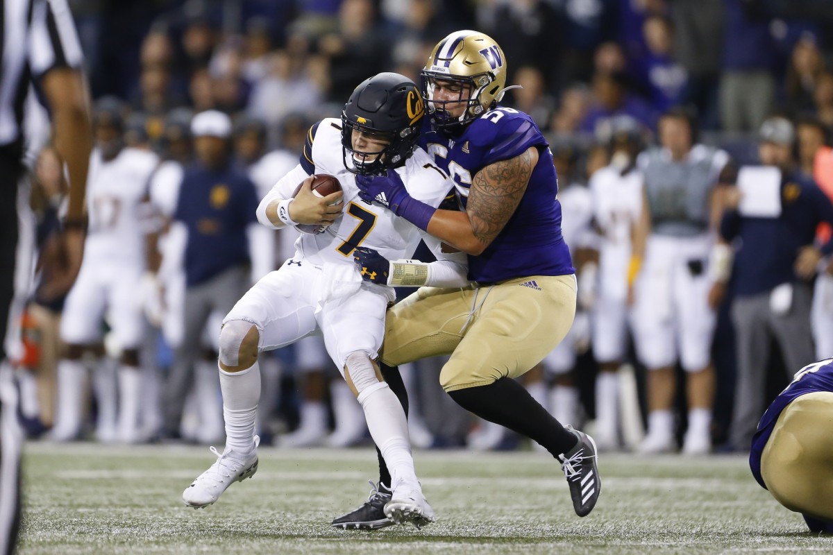 Laiatu Latu sacked Chase Garbers in 2019; the edge rusher has since retired because of a neck injury.